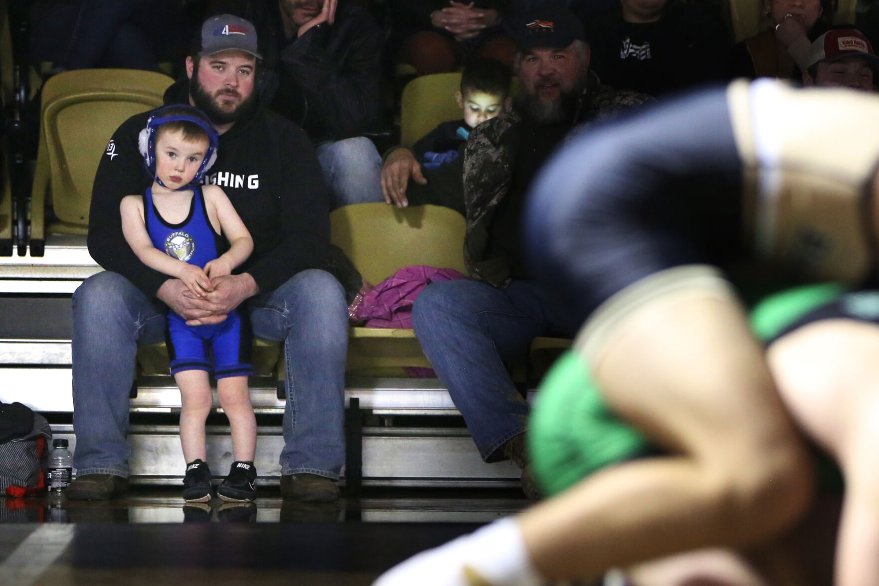 Korwin Nicholson, 4, leans against his dad